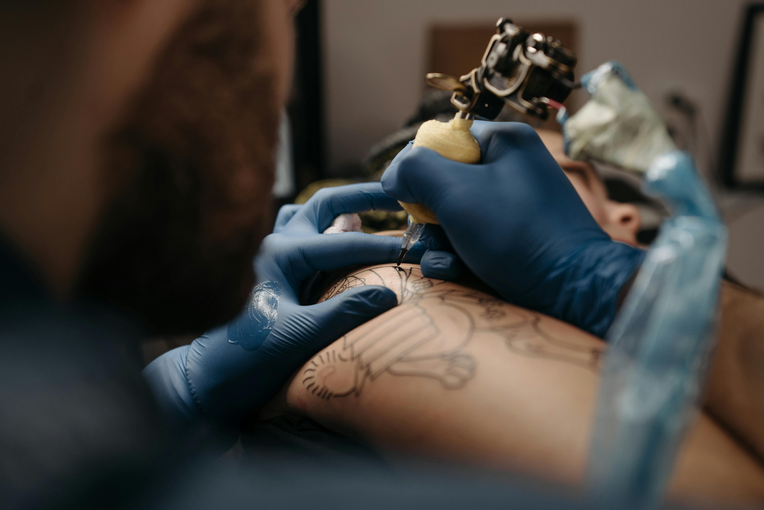 Tattoo artist promoting their work and attracting new clients through social media